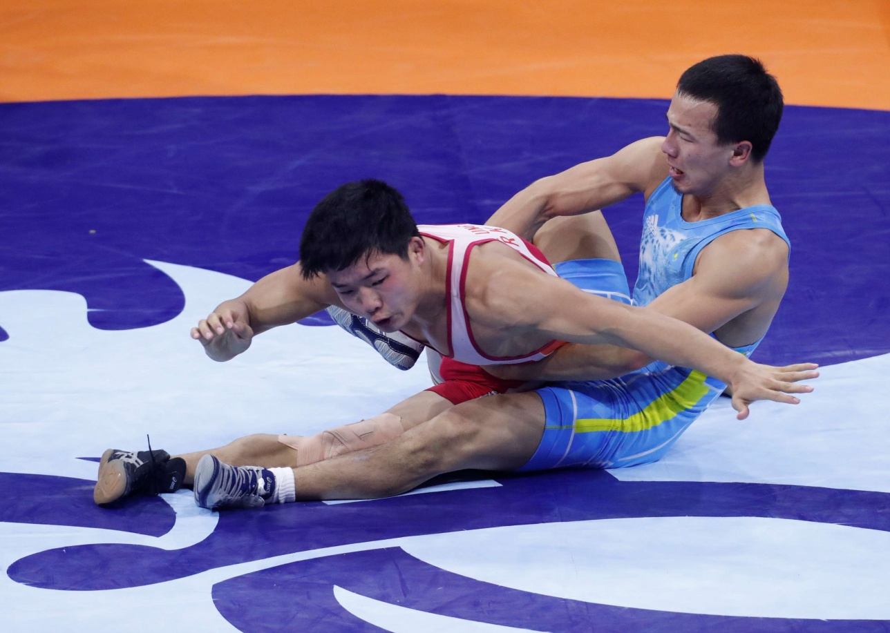 گرەك-ريم كۇرەسىنەن قوس قولا مەدالدى يەلەندىك